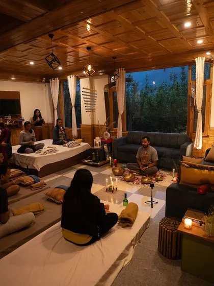 I also create intimate, cozy settings for smaller groups. This candlelit indoor session shows a space designed for deep connection and personal transformation, where every detail is arranged to support your journey inward.