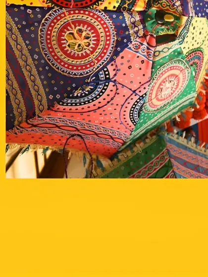 A detail shot of a colorful, patterned Rajasthani umbrella, a key element in creating a festive and traditional atmosphere for Haldi or Mehendi events.