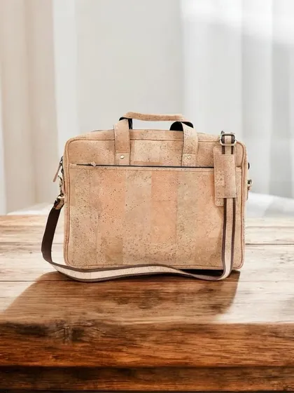 My cork laptop bag is a stylish and sustainable choice for carrying your tech. It's lightweight, durable, and water-resistant, featuring multiple compartments and a comfortable shoulder strap.