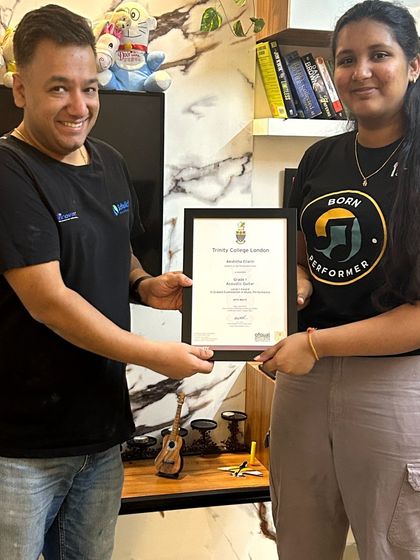 Officially certified! Presenting Akshitha with her Trinity College London certificate. Her hard work and passion for the guitar have truly paid off.