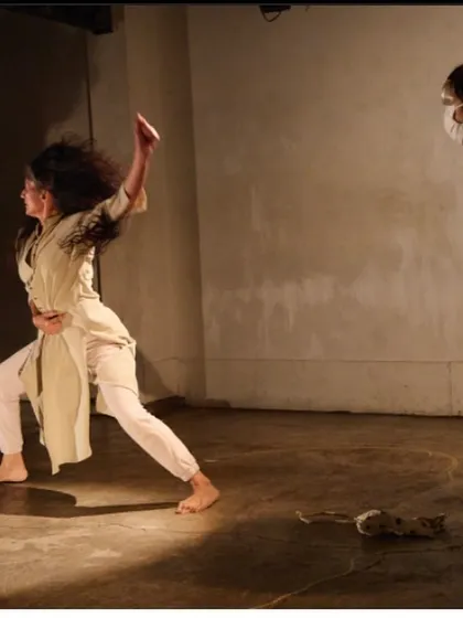 Another angle from "DANDYLION," showcasing a moment of intense physical expression. This solo work is a conversation with the earth, a plea for connection and understanding.