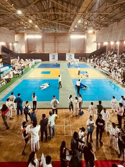 The arena where our training is tested. A wide view of the SENSEI N.T. & M.N. BANGERA Memorial Judo Championship, where our Judokas went to compete and prove their skills. We build fighters ready for the big stage.