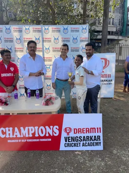 Darshan Rathod receiving the Best Bowler award for the tournament. His 9 wickets were crucial to our team's success.