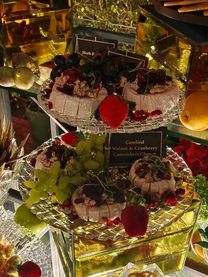 Candied walnut and cranberry Camembert cheese wheels. This sweet and savoury combination is a unique and delicious offering on our cheese boards.