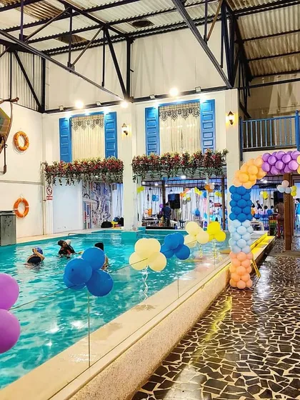 We're not just about fitness and therapy; we're about celebration too. Our space transforms beautifully for private events, like this birthday pool party setup with colorful balloons and a festive atmosphere.