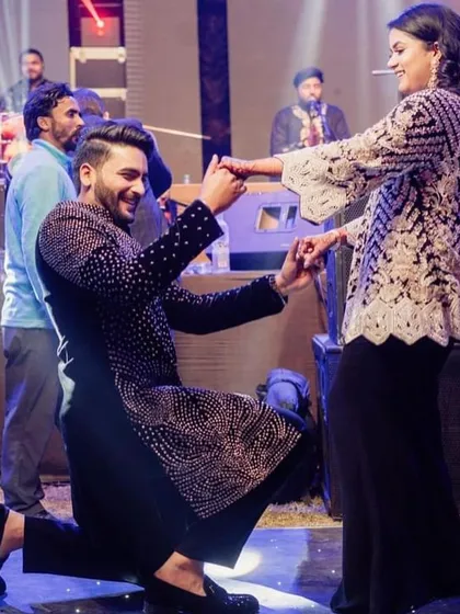 A romantic proposal pose is always a crowd-pleaser in a couple's dance. It adds that extra touch of filmy magic.