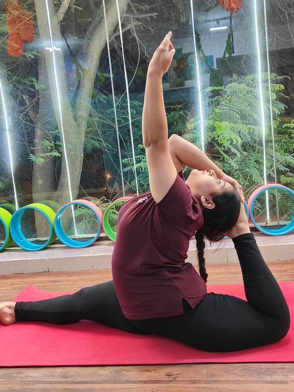 A beautiful expression of Eka Pada Rajakapotasana (One-Legged King Pigeon Pose), showcasing open hips and a flexible spine.
