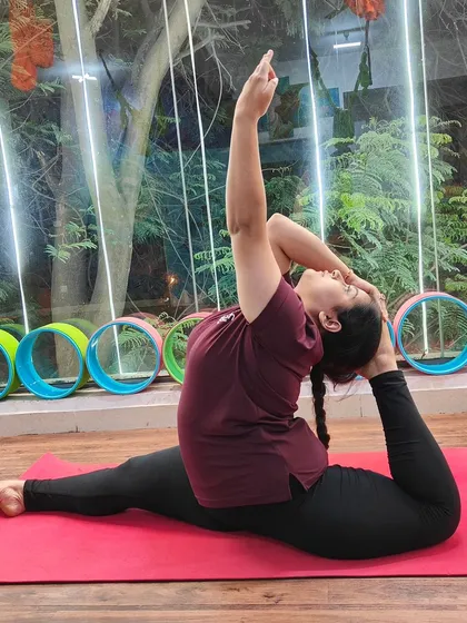A beautiful expression of Eka Pada Rajakapotasana (One-Legged King Pigeon Pose), showcasing open hips and a flexible spine.
