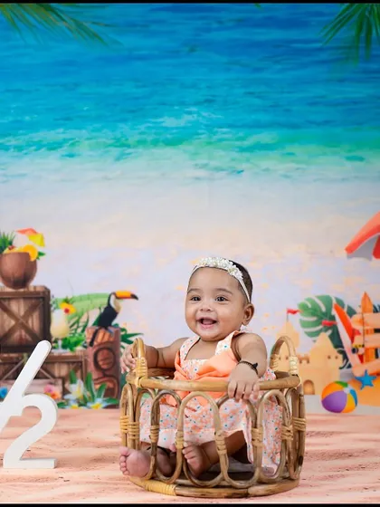 All smiles from her little basket on the beach. This half-birthday shoot is full of sunshine and happy vibes.