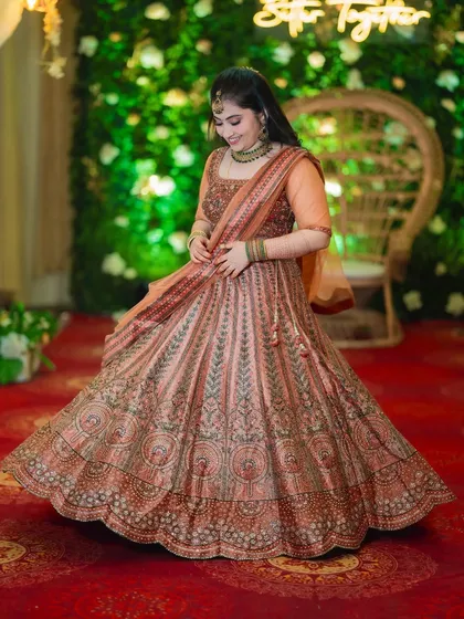 A beautiful solo portrait of the bride, Pooja, twirling in her intricate lehenga. I always make sure to capture the bride feeling her best in her stunning outfit.