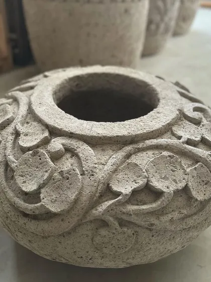 Another angle of the 'Daun' planter, highlighting its unique shape and artisan details.