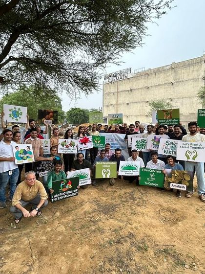 The Estee Advisors team proudly displays their signs after planting 500 saplings, contributing to a greener future for Gurgaon.