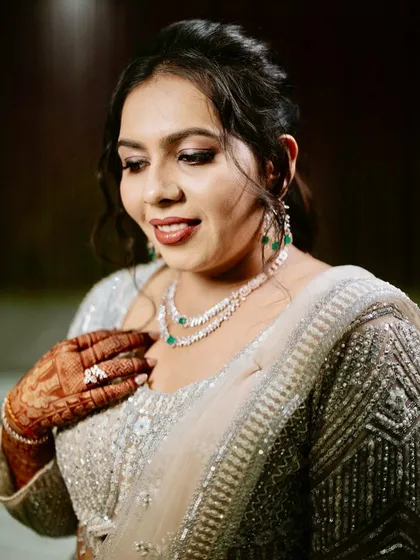 A closer look at the soft glam makeup for this reception look. The shimmer on the eyes is subtle yet impactful, and the skin is flawless.