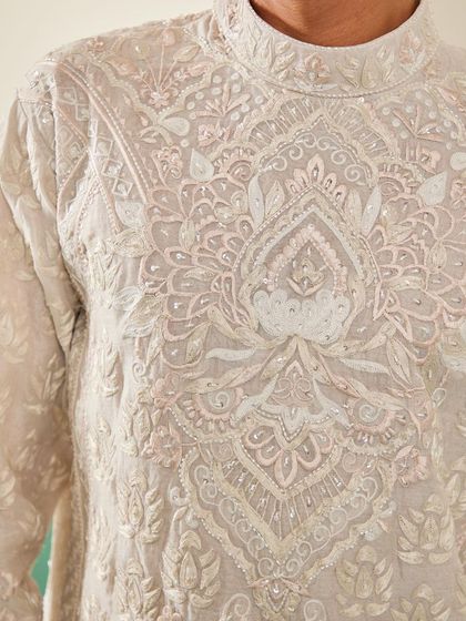 A close-up of our beige kurta, showcasing the dense and intricate tone-on-tone hand-embroidery.