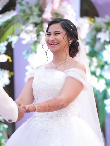 The pure happiness of a bride on her wedding day. For this Christian wedding, I created a soft, natural look with a simple updo to let her joyful smile be the focus. The makeup was designed to be light, fresh, and perfect for an outdoor ceremony.