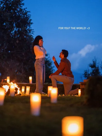 Capturing a surprise proposal is one of my favorite things. I help plan the moment so it's perfect, focusing on the genuine shock and joy. This candlelit setup in the hills made for an unforgettable "yes" moment.