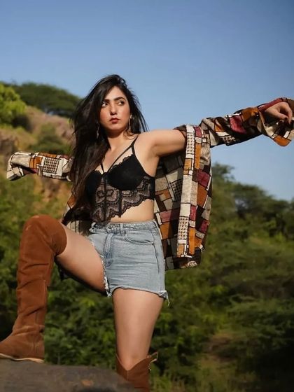 A powerful pose in my outdoor shoot look, showing how to style layers for a dynamic outfit.