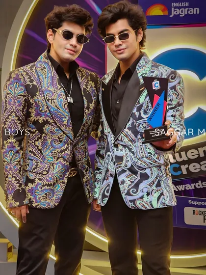 A closer look at the Sobo Guys' printed jackets. The satin lapels provide a classic anchor to the vibrant, peppy prints, creating a look that is both fun and sophisticated.