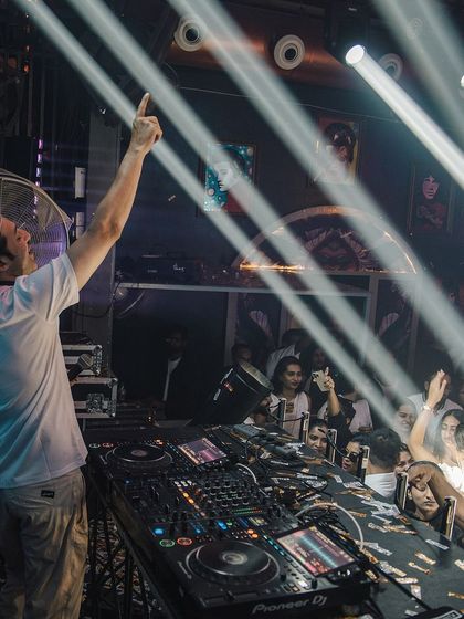 A powerful shot with beams of light cutting through the smoke at Happy Brew.