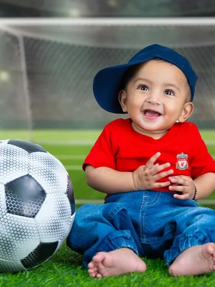 A close-up of our happy little footballer. I can customize these sports themes to feature your family's favorite team.