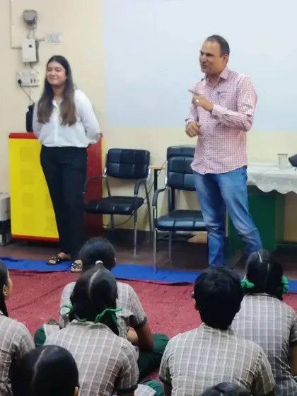Interacting with students during a career guidance session.