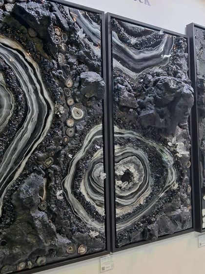 A striking three-panel artwork by Maria Molaei, using natural minerals and textures to create a 'Mysterious Land'. This piece showcases innovative techniques in mixed-media art.