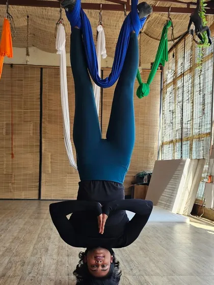 An inverted prayer pose, which is a fantastic way to build shoulder stability and core control. The view from my training in Rishikesh wasn't bad either.