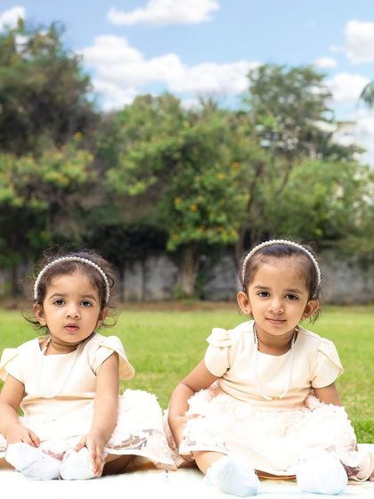 A fun outdoor session with three sisters. I love capturing the natural light and genuine interactions of children playing together in a park setting.