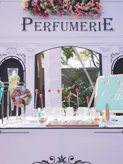A 'PerfumierE' stall designed in the line art style, offering a unique and fragrant experience for guests, complete with a candle-making station.