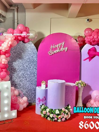 A modern and chic 11th birthday setup. The decoration uses arched backdrops in pink and purple, a shimmer panel, and marquee numbers.