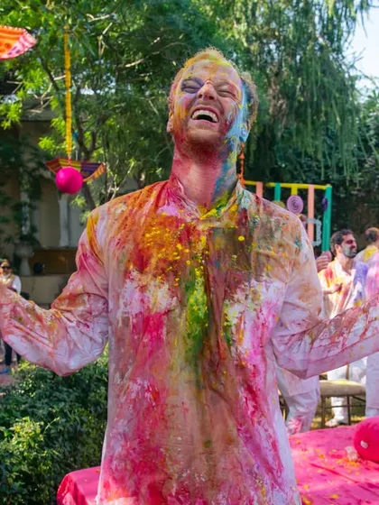 A moment of pure, uninhibited joy during a Holi party.