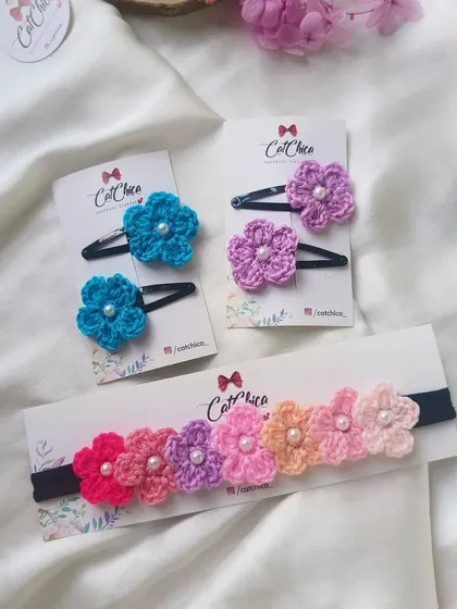 This image shows our floral newborn headbands alongside some matching floral clips. You can mix and match to create the perfect set.