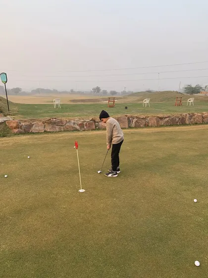 A young golfer honing his putting skills. Our facilities are designed to be used and enjoyed by players of all ages.