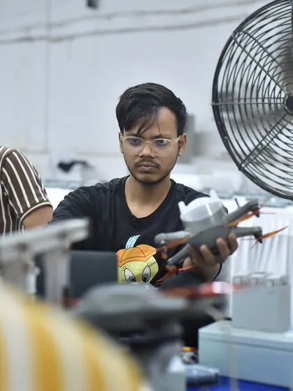 On Engineer's Day, we celebrate the innovators on our team. This engineer is seen making final checks on a drone, a glimpse into the precision and passion that powers every show.