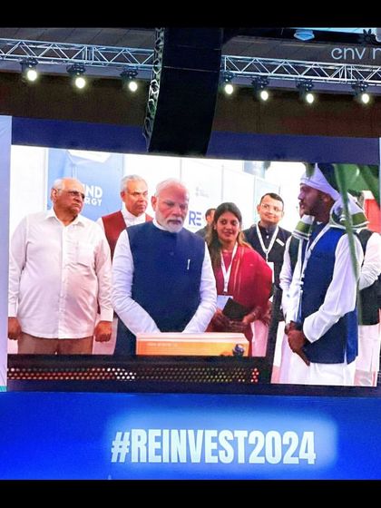 Another view of our interaction with the Prime Minister on the main screen at Re-Invest 2024. This event was a significant platform for us to showcase our sustainable solutions to a national audience.