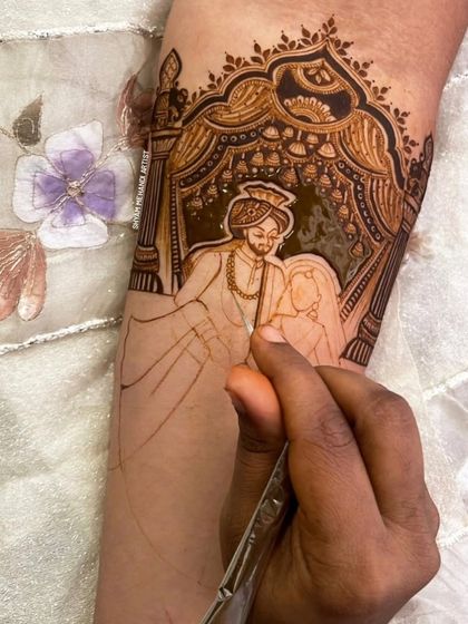 The work in progress, as I carefully fill in the details of a custom couple portrait with my henna cone.