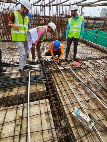My team on site at the Runwal Timeless project, inspecting the reinforcement steel before a concrete pour. This attention to detail at every stage of construction is what ensures the quality and longevity of our buildings.