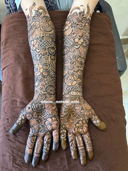 A full-coverage design with a focus on floral and leaf patterns, perfect for a bride who loves nature-inspired art.