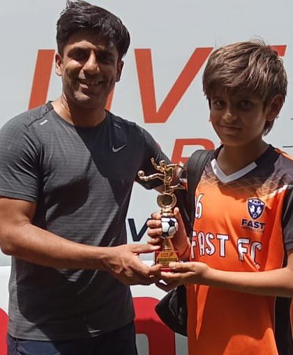 One of our U11 players receiving his runners-up trophy after a great performance in the Junior Cup.