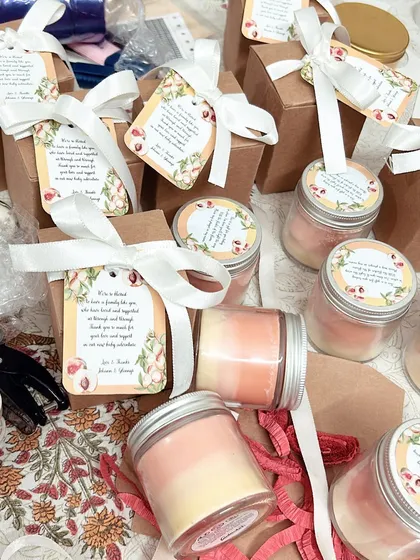 The full set of peach-themed ombre candles we created for a baby shower. Each one was packed in a box with a custom thank you tag.