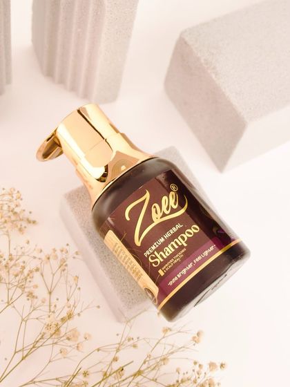 This is my Premium Herbal Shampoo, formulated to promote thicker strands and improve scalp health. It's your first step towards achieving fuller, stronger, and healthier hair from the root.