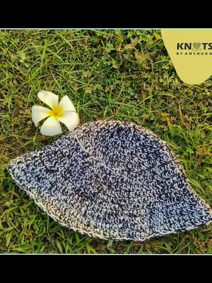 My very first summer bucket hat design. This black and white speckled hat is made from cotton yarn, perfect for sunny days.