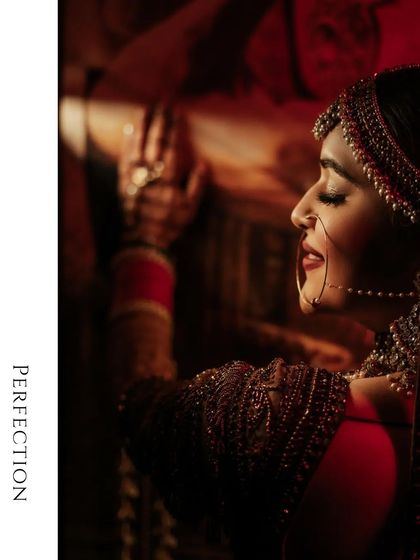 A side-profile portrait of Vanshita, her eyes closed, the soft lighting highlighting the perfect details of her bridal look.