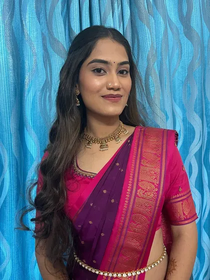 A smiling portrait of the happy client. The makeup is subtle enough for a day event but still feels special.
