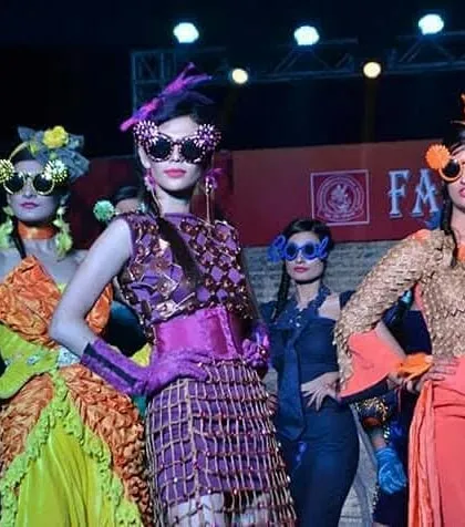 Our students are encouraged to push creative boundaries. This collection features bold, avant-garde designs with intricate textures, vibrant colors, and handmade statement accessories like the oversized sunglasses, showing a high level of craftsmanship.