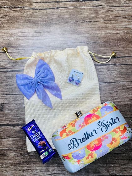 A colorful "Brother-Sister" themed clutch combo, perfect as a return gift for your sister on Raksha Bandhan.
