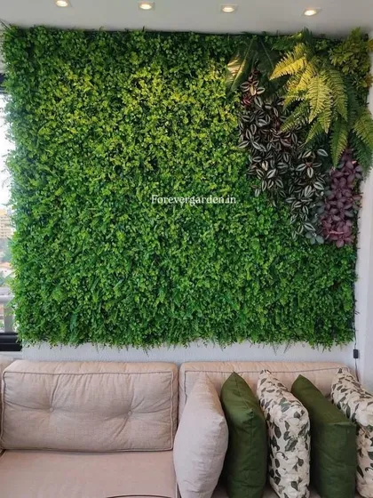 A living room feature wall made of artificial greenery, creating a stunning and relaxing backdrop for the sofa.