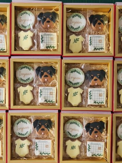 We were so honoured to create these beautiful cookie sets to announce the arrival of a new baby. Each box included custom cookies with the baby's name, birth date, and a cute dog portrait.