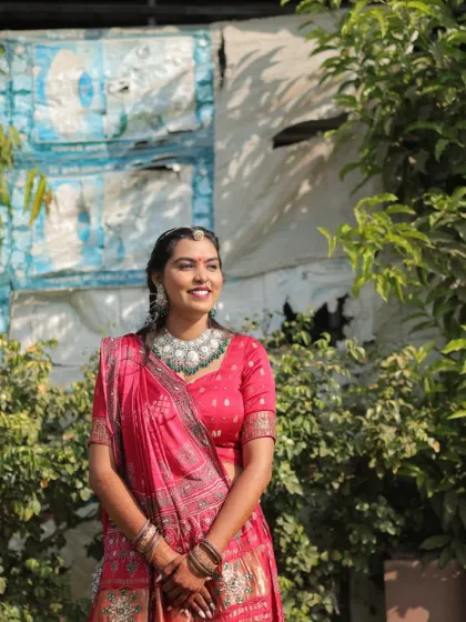 A radiant look for a Lagan Lekhan ceremony. The bride is glowing in a pink traditional outfit, with her makeup kept fresh and elegant.