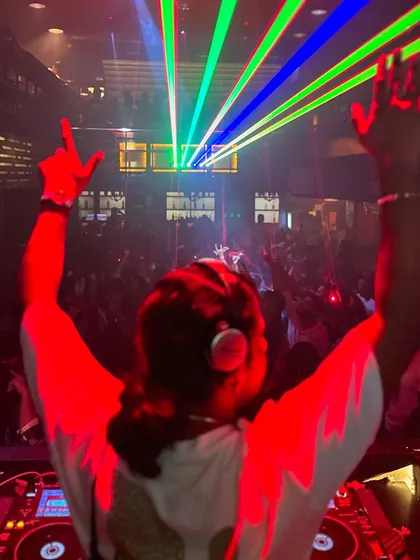 Capturing that one perfect moment where the lights, the music, and the crowd's energy all align. My hands go up with the crowd because we're all in it together, making memories one beat at a time.